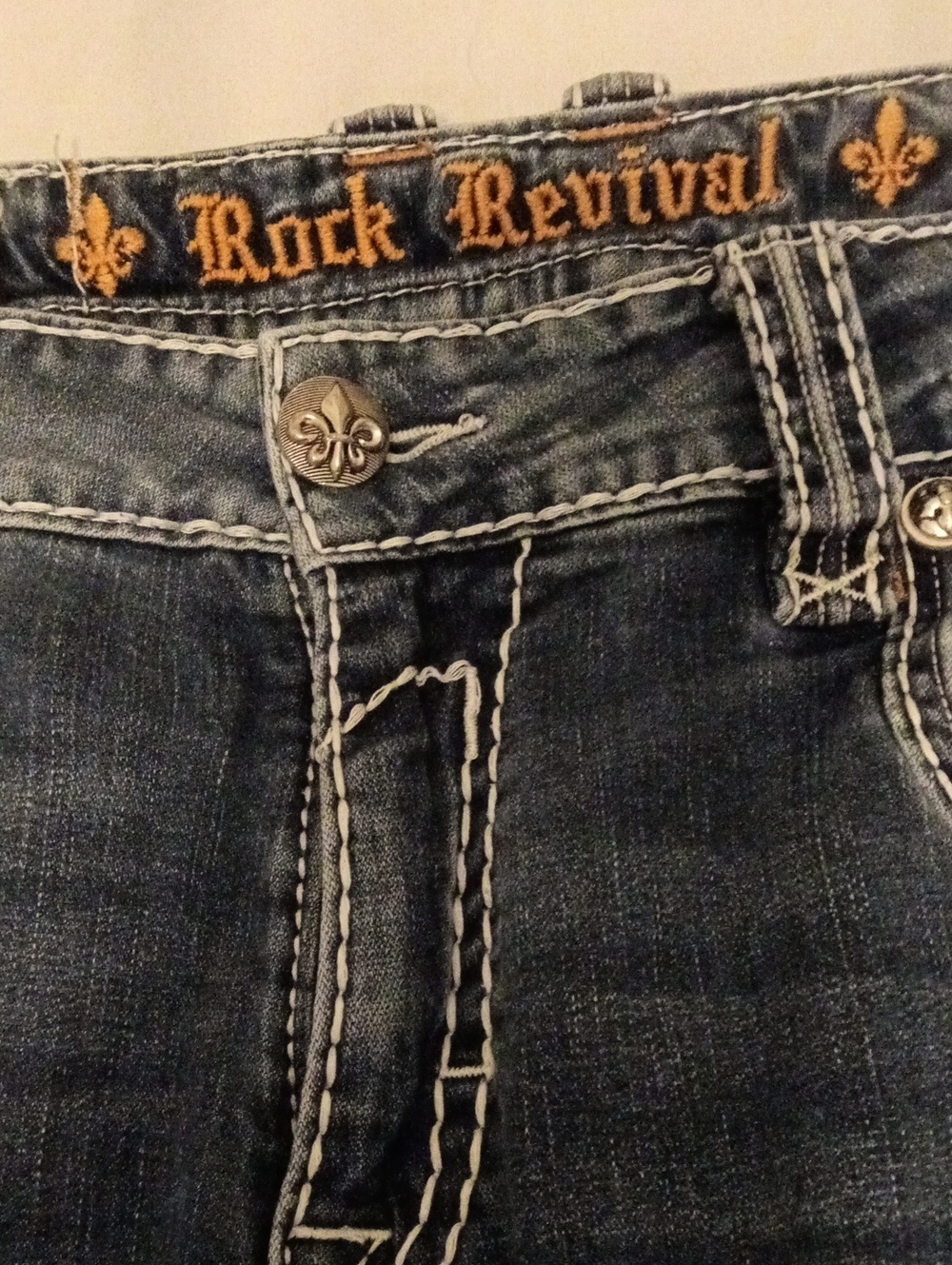 Rock Revival Men's Washed Blue Slim Jeans with Contrast Stitching. Stretch Feel